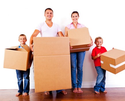 Customer booking paperwork and moving boxes for a removal service