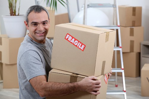 Moving truck parked in Shepherdsbush for a residential relocation