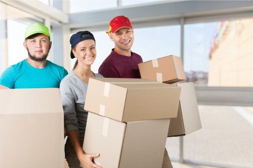 Movers handling furniture during a local Shepherdsbush relocation