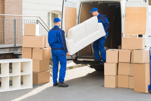 Residential removals team handling belongings in Shepherdsbush