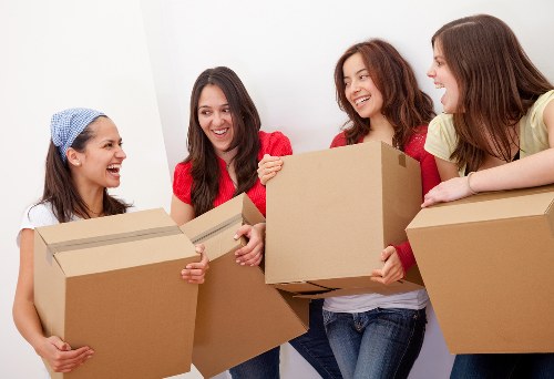 Loading household furniture into a removal truck in Shepherdsbush