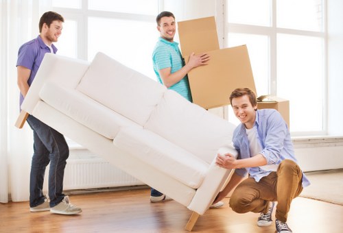 Loading furniture and boxes into a van for a Shepherds Bush removal
