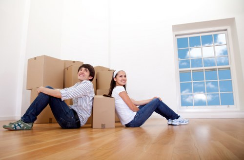 Packed moving boxes and furniture inside a West London home