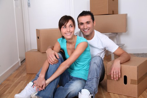 Professional moving team handling furniture in Shepherds Bush