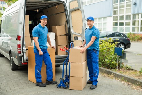 Professional movers handling office furniture in Shepherds Bush