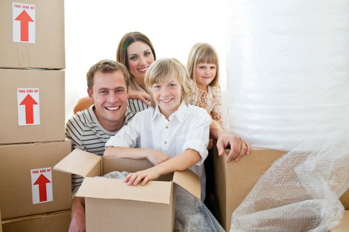 Professional movers loading furniture during house removals