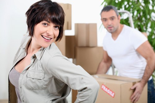 Professional furniture collection team removing old furniture from a Shepherdsbush property