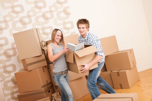 Mover wearing PPE while handling furniture carefully