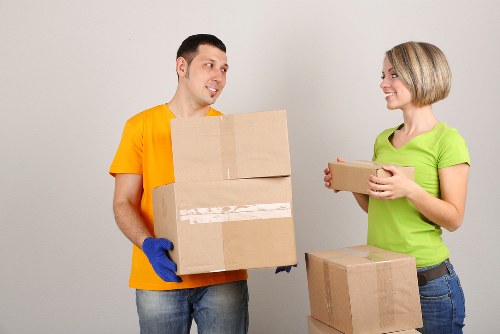 Packed office furniture and boxes prepared for transport in West London